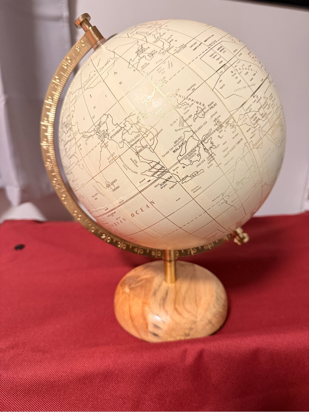 Cream Decorative Table Globe with Gold Arm and Wood Base